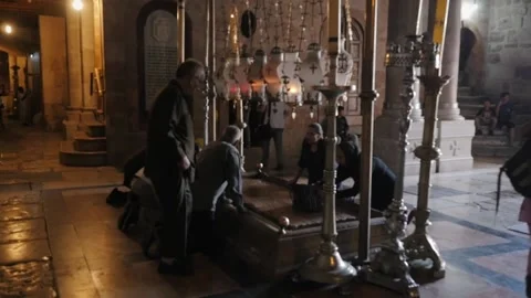 Prayers touch Anointing Stone to get blessing in temple Stock Footage 179311596