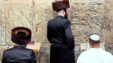 Prayers at the wailing wall in jerusalem by orthodox jews Stock Footage 337893412