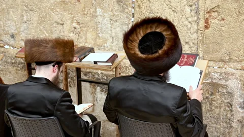 Prayers at the wailing wall in jerusalem by orthodox jews Stock Footage 337893834