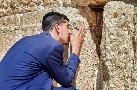 Prayers at the wailing wall in jerusalem by orthodox jews Stock Photos