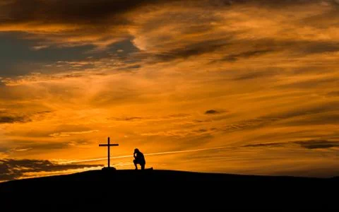 Prayful man cross Stock Photos