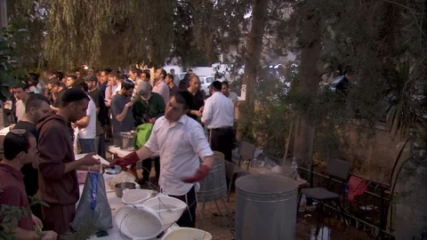 Praying and cleansing Passover kitchen utensils and dishes. Jerusalem. C0074-1 Stock-Footage 98544144