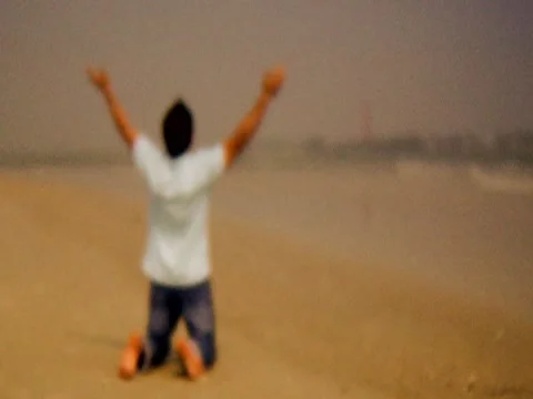 Praying On Beach 1 Stock Footage 8691894