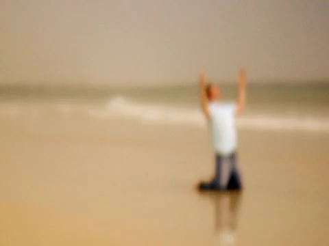 Praying On Beach 2 Stock Footage 8691895