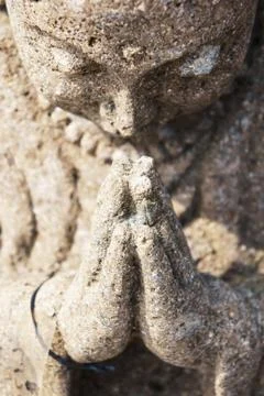 Praying buddha Stock Photos
