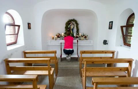 Praying in chapel Stock Photos