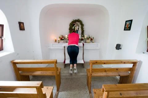 Praying in chapel Stock Photos