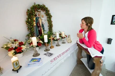 Praying in chapel Stock Photos