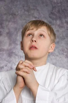 Praying choirboy Foto stock