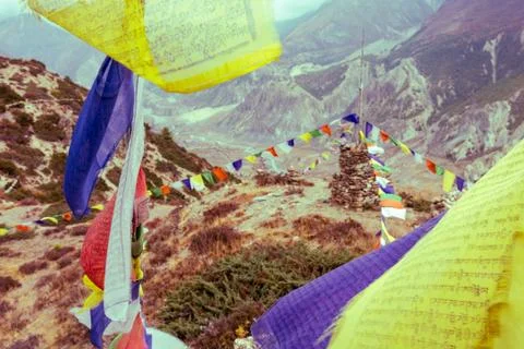 Praying flags with stupa in the background. Stock Photos