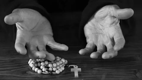 Praying to God with hand's together with cross and with people black background Stock Footage 333940129