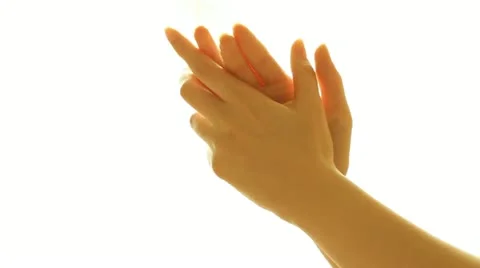 Praying hands against white background Stock Footage