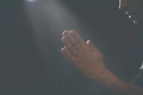 Praying Hands in black background Stock Photos