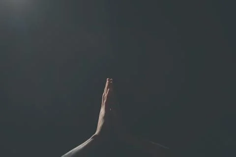 Praying Hands in black background Stock Photos