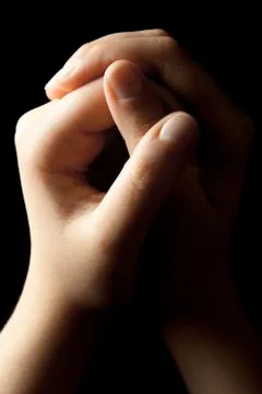 Praying Hands on Black Background Stock Photos