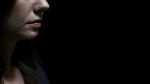 Praying with hands clasped together on dark black background. 스톡 동영상 32958493