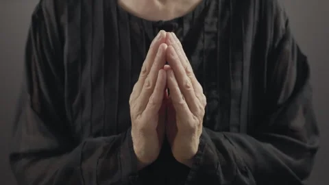Praying hands on dark background Stock-Footage 335192357