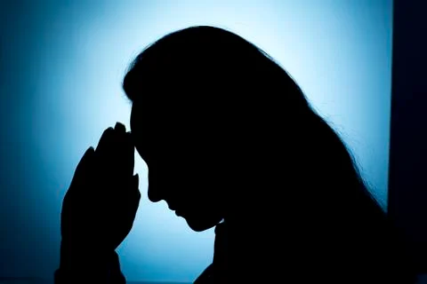 Praying Hands in dark background Stock Photos