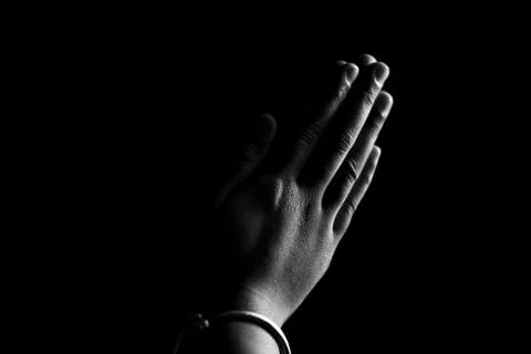 Praying Hands with faith on drak background. Stock Photos