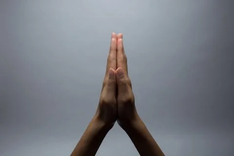 Praying Hands on a grey background Stock Photos