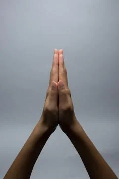 Praying Hands on a grey background Stock Photos