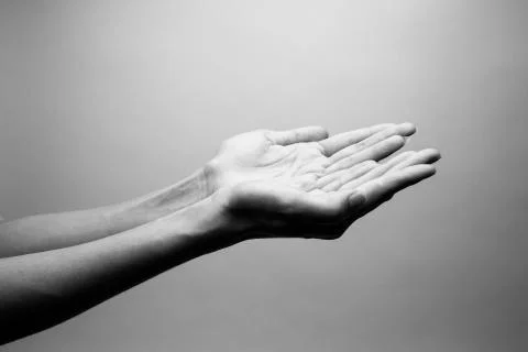 Praying Hands with a grey background Stock Photos