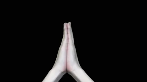Praying hands with hope on a black background Stock Footage 146011794