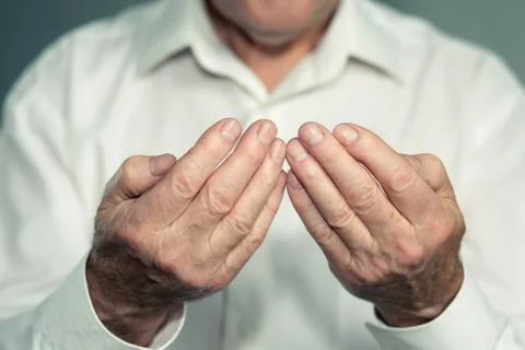 Praying hands of an old man Фото