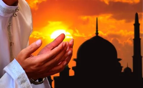 Praying hands with sunset background Foto stock