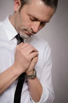 Praying handsome man Stock Photos
