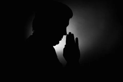 Praying Man Silhouette Stock Photos