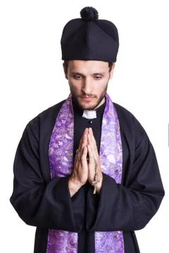 Praying priest Foto stock