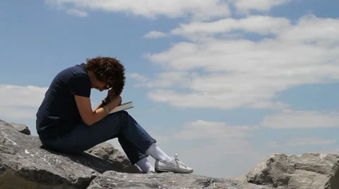 Praying On Rocks Stock Footage 5297479