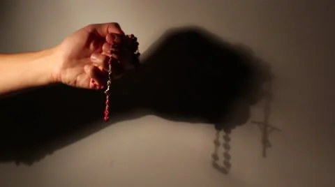 Praying the rosary Stock Footage 68569996