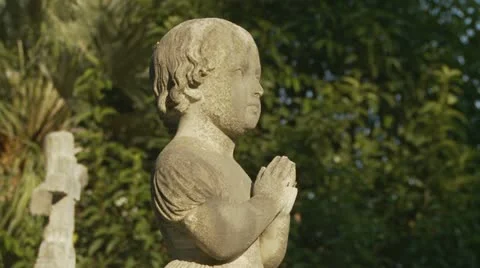 Praying statue in cemetery Stock Footage 10858959