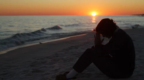 Praying At Sunset Stock Footage 923822