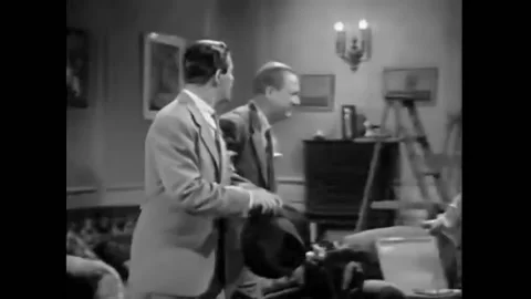 In this pre-Code crime drama film, a man interrupts a poker game to tell the Stock Footage 241806183