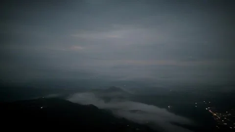 Pre-Dawn Bands Light a Cloud Deck Over a Waking Mountain Valley Stock Footage 316795378