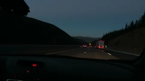 Pre dawn drive on freeway, first light changing in background. Stockbeeldmateriaal 97432485