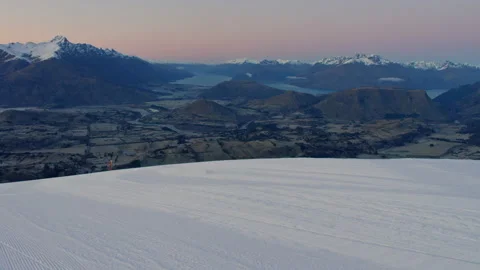 Pre dawn ski slope with mountains and lakes in distance hand held pov Stock Footage 159695735