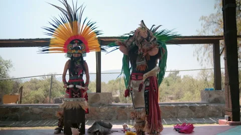 Pre-Hispanic dancers playing instruments with bright sky as background Stock Footage 162069162