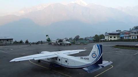 A pre-launch check of the flaps on a passenger plane in Tenzing-Hillary Airport Stock Footage 125388858
