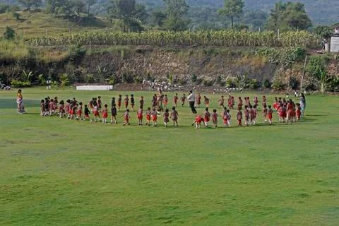 Pre primary students playing on ground, india Stock Photos