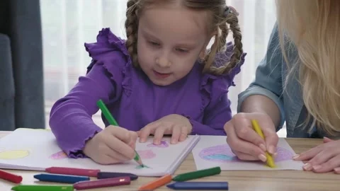 Pre school art class for creativity. teacher helps to little girl to learn Stock-Footage 237029511