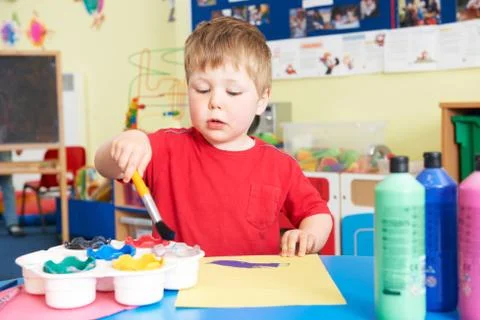 Pre School Boy Enjoying Painting Class Stock Photos