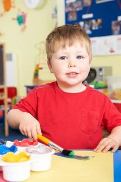 Pre School Boy Enjoying Painting Class Stock Photos