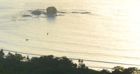 Pre-Sunset Light Shines On Distant Ocean Coastline And Each Set Of Waves Stock Footage 138079947