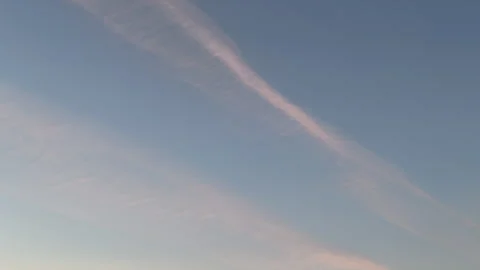 Pre sunset sky time lapse with soft airplane contrail and evening cloud Stock Footage 339500971