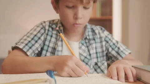 Pre-teen Boy Doing Difficult Homework fo... | Stock Video | Pond5
