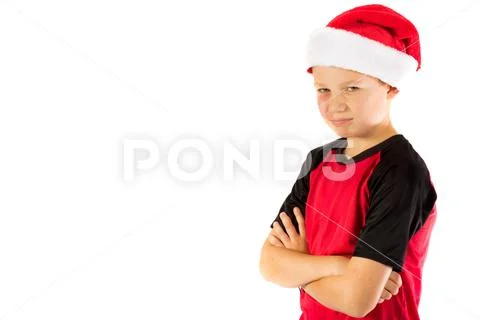 Pre-teen boy wearing a santa hat Stock Photos